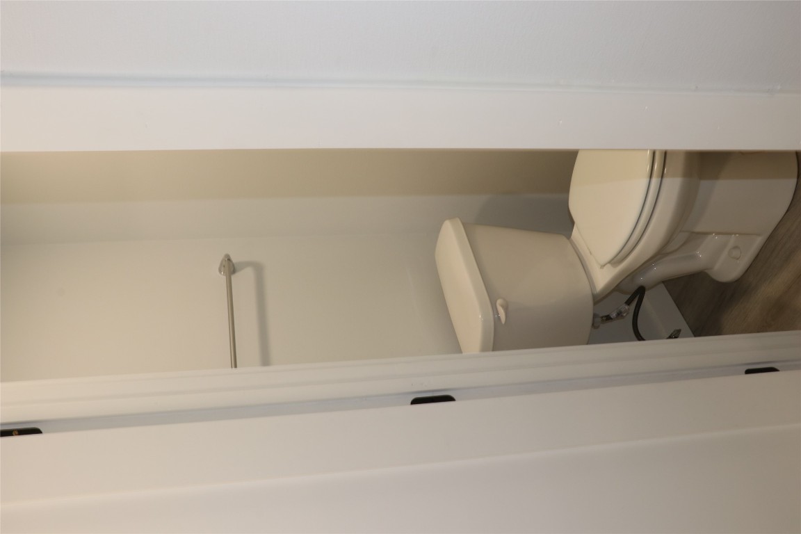 8903 Mesa Drive, Unit A Austin, TX 78759 - Photo 7 of 27 a white toilet sitting next to a shower