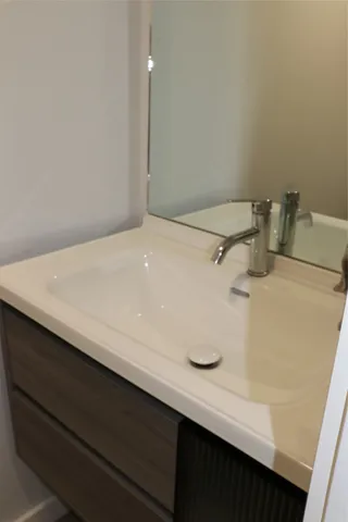 a kitchen with granite countertop cabinets and steel stove top oven