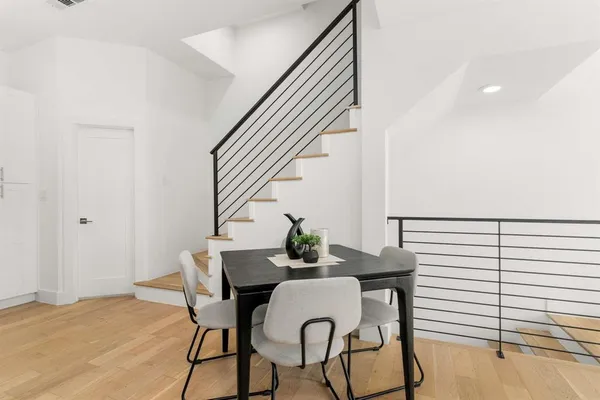 a kitchen with stainless steel appliances granite countertop white cabinets a sink and dishwasher