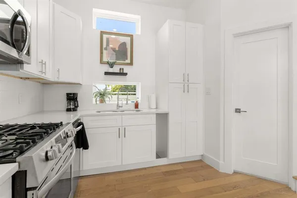 a bathroom with a sink mirror and toilet