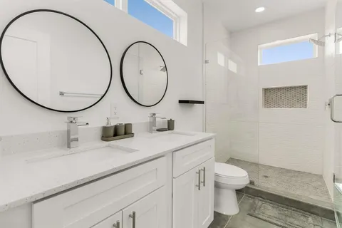 a bedroom with a bed and a shower