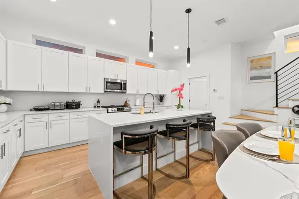 a bedroom with a large bed and a large window