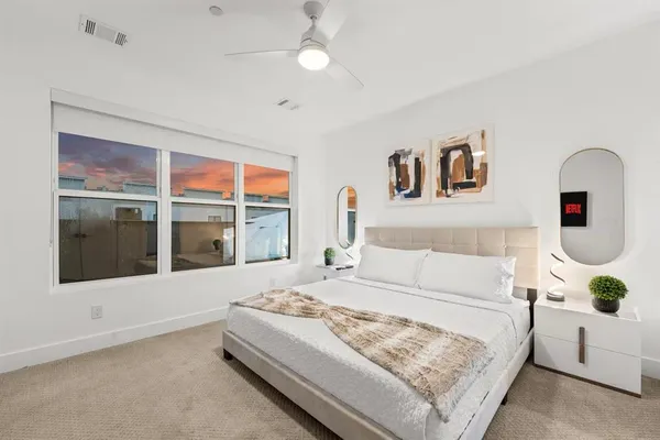 a bedroom with a bed and a view of bathroom