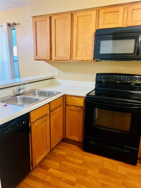 2215 Post Road, Unit 1033 Austin, TX 78704 - Photo 3 of 8 a kitchen with granite countertop a stove and a microwave