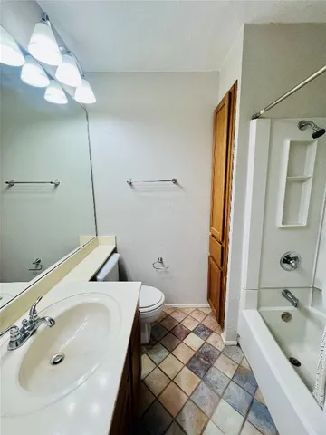 a bathroom with a sink and a toilet