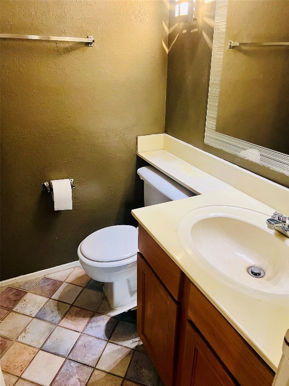 2215 Post Road, Unit 1033 Austin, TX 78704 - Photo 7 of 8 a bathroom with a sink and a toilet