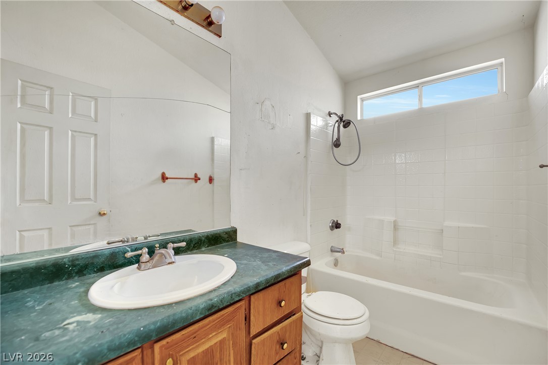 4361 Maple Road Pahrump, NV 89048 - Photo 30 of 46 A well-lit bathroom with a vanity and a shower-tub combination awaits your personal touch.