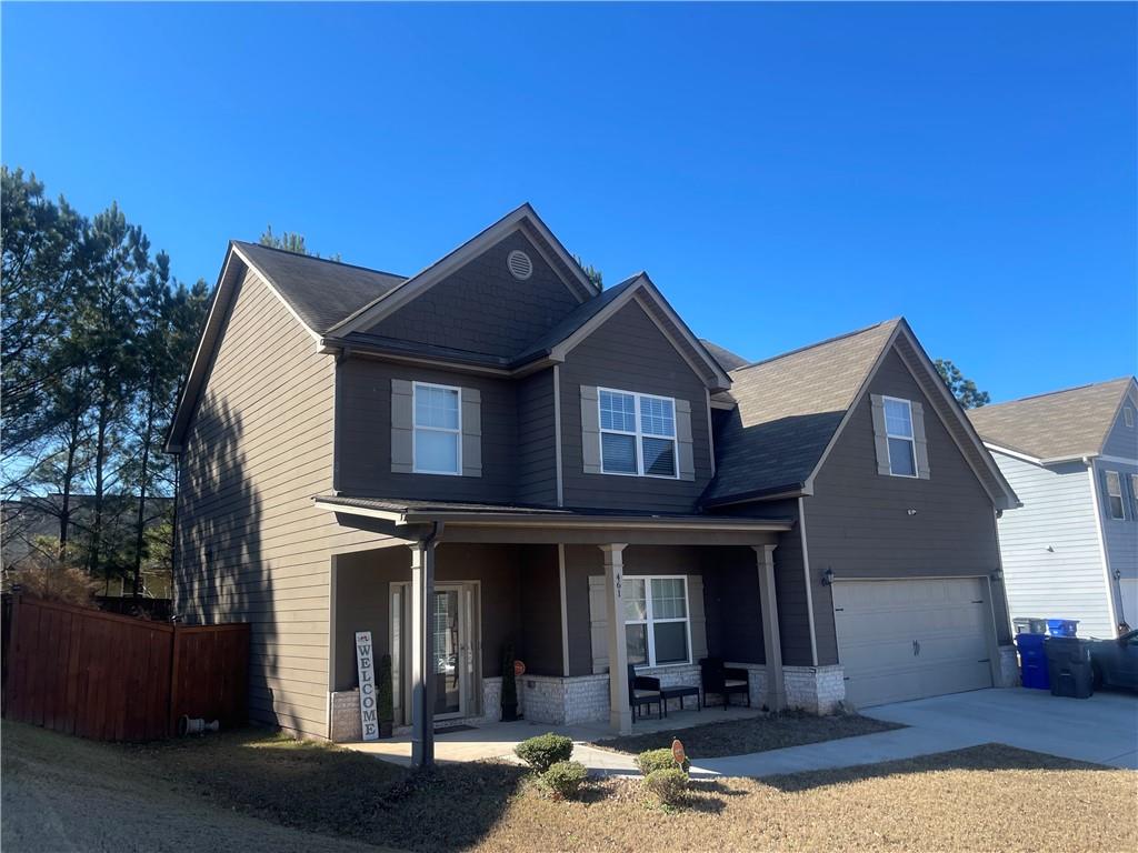 a front view of a house with garage