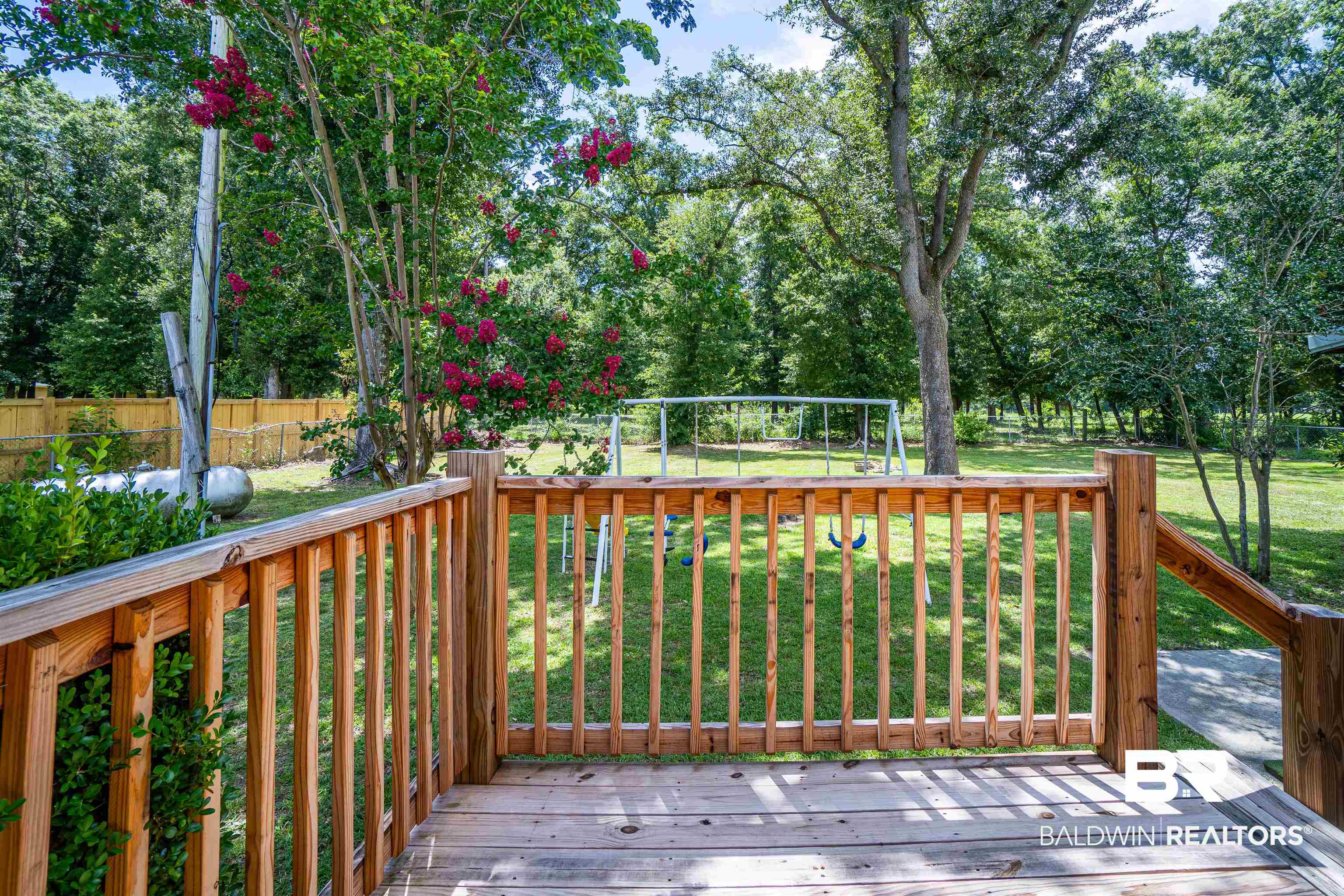 10349 Longview Drive West Foley, AL 36535 - Photo 11 of 35 Wooden terrace with a lawn