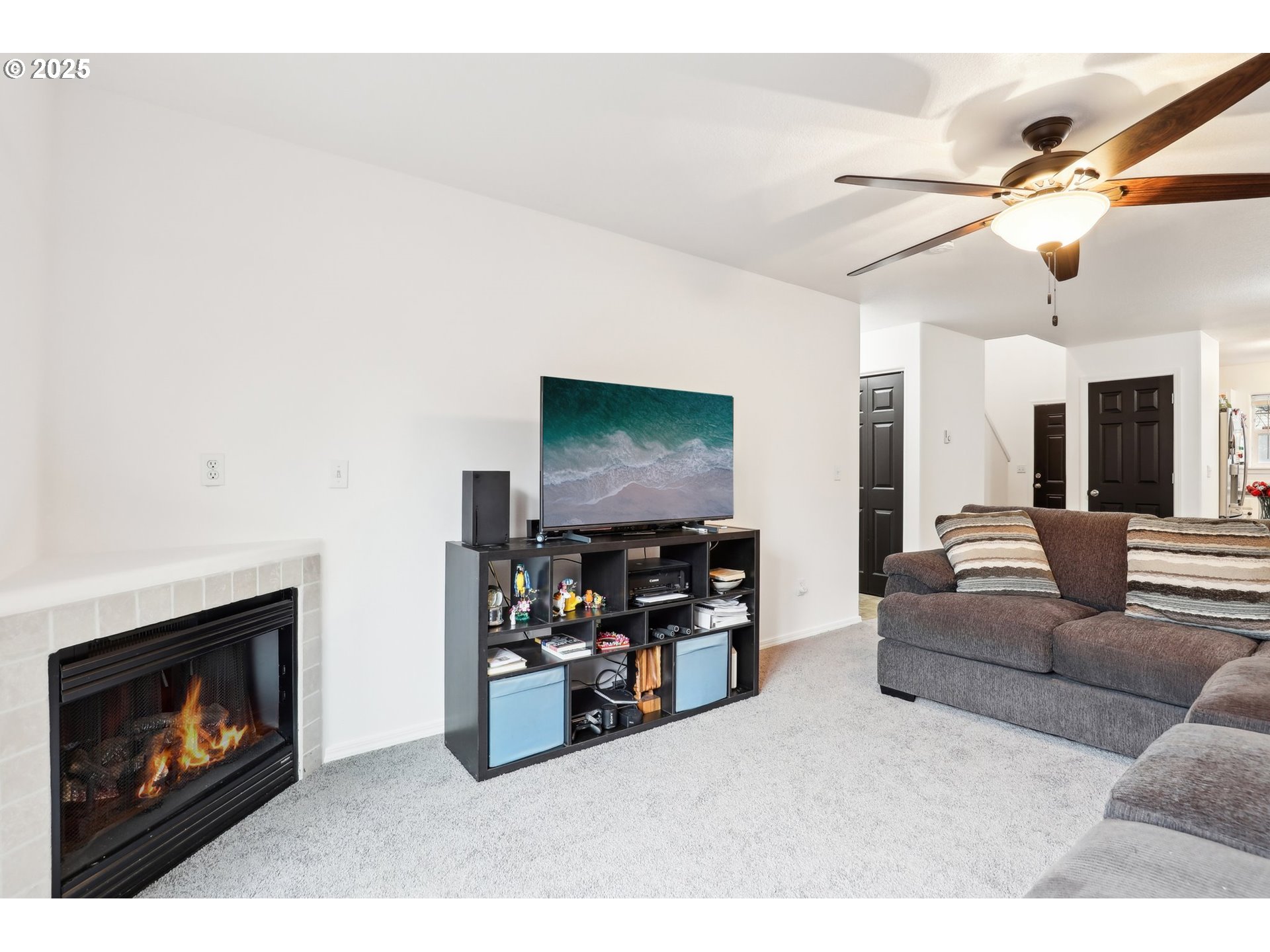 19153 Southeast Yamhill Street, Unit 21 Portland, OR 97233 - Photo 5 of 22 a living room with furniture and a flat screen tv