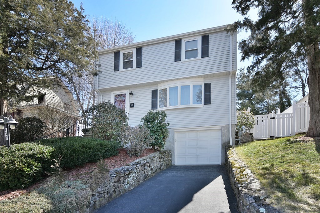 130 Florence Road Waltham, MA 02453 - Photo 1 of 26 a front view of a house with a yard