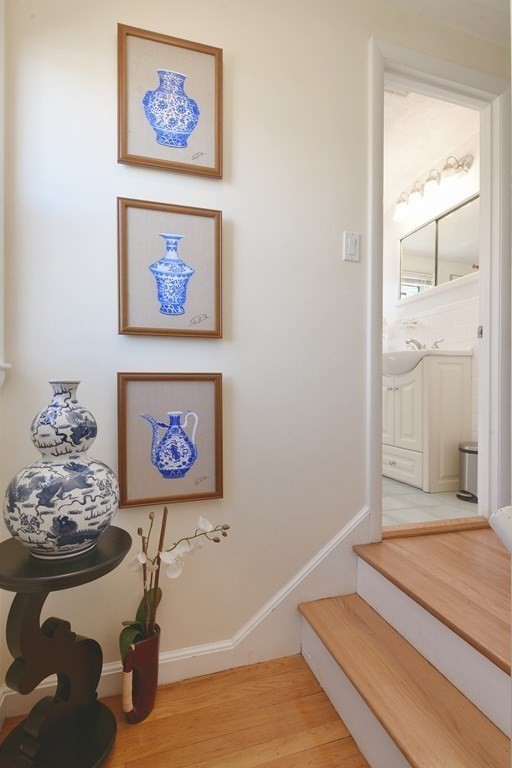 130 Florence Road Waltham, MA 02453 - Photo 13 of 26 a view of a hallway with paintings on the wall