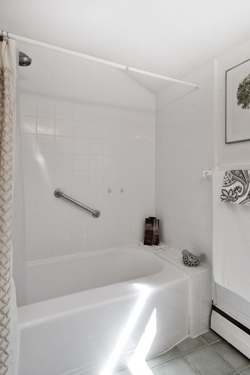 130 Florence Road Waltham, MA 02453 - Photo 18 of 26 a bathroom with a bathtub