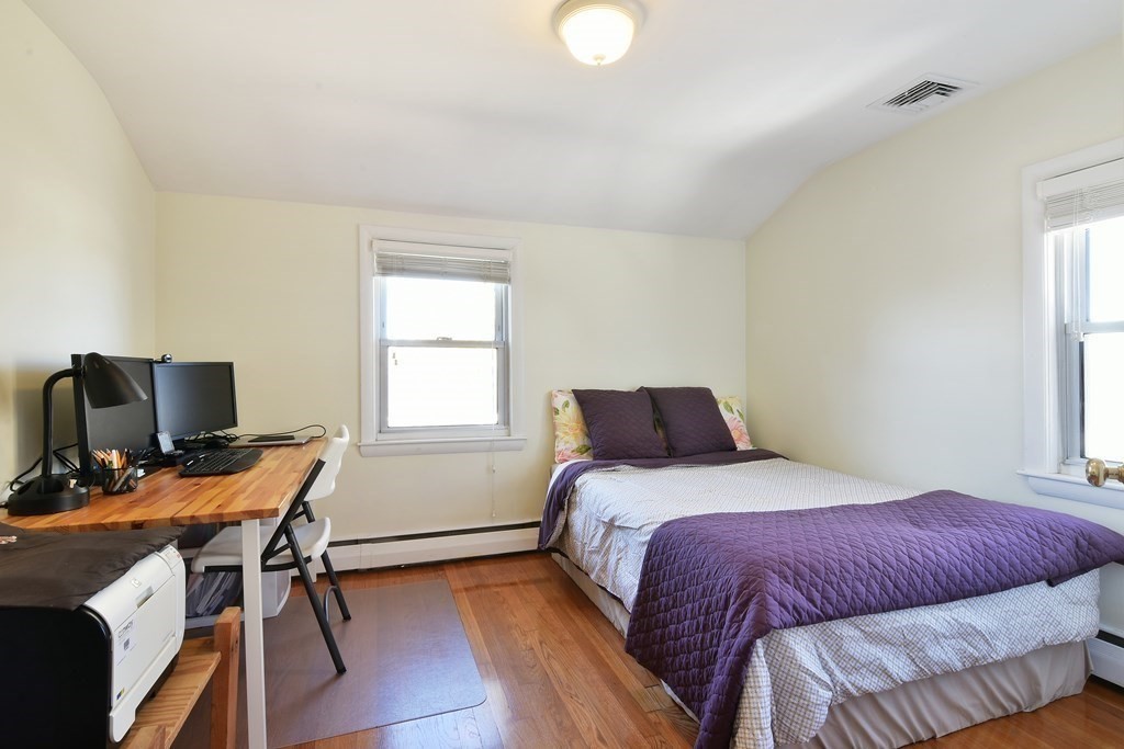 130 Florence Road Waltham, MA 02453 - Photo 20 of 26 a bedroom with a bed and a window