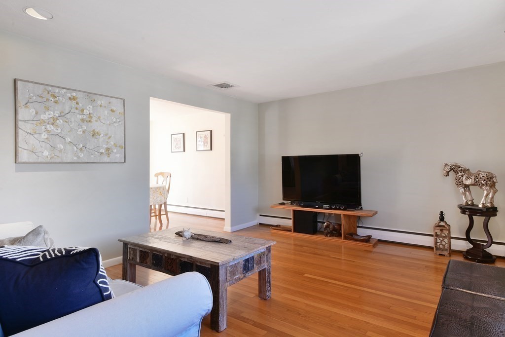 130 Florence Road Waltham, MA 02453 - Photo 3 of 26 a living room with furniture and a flat screen tv