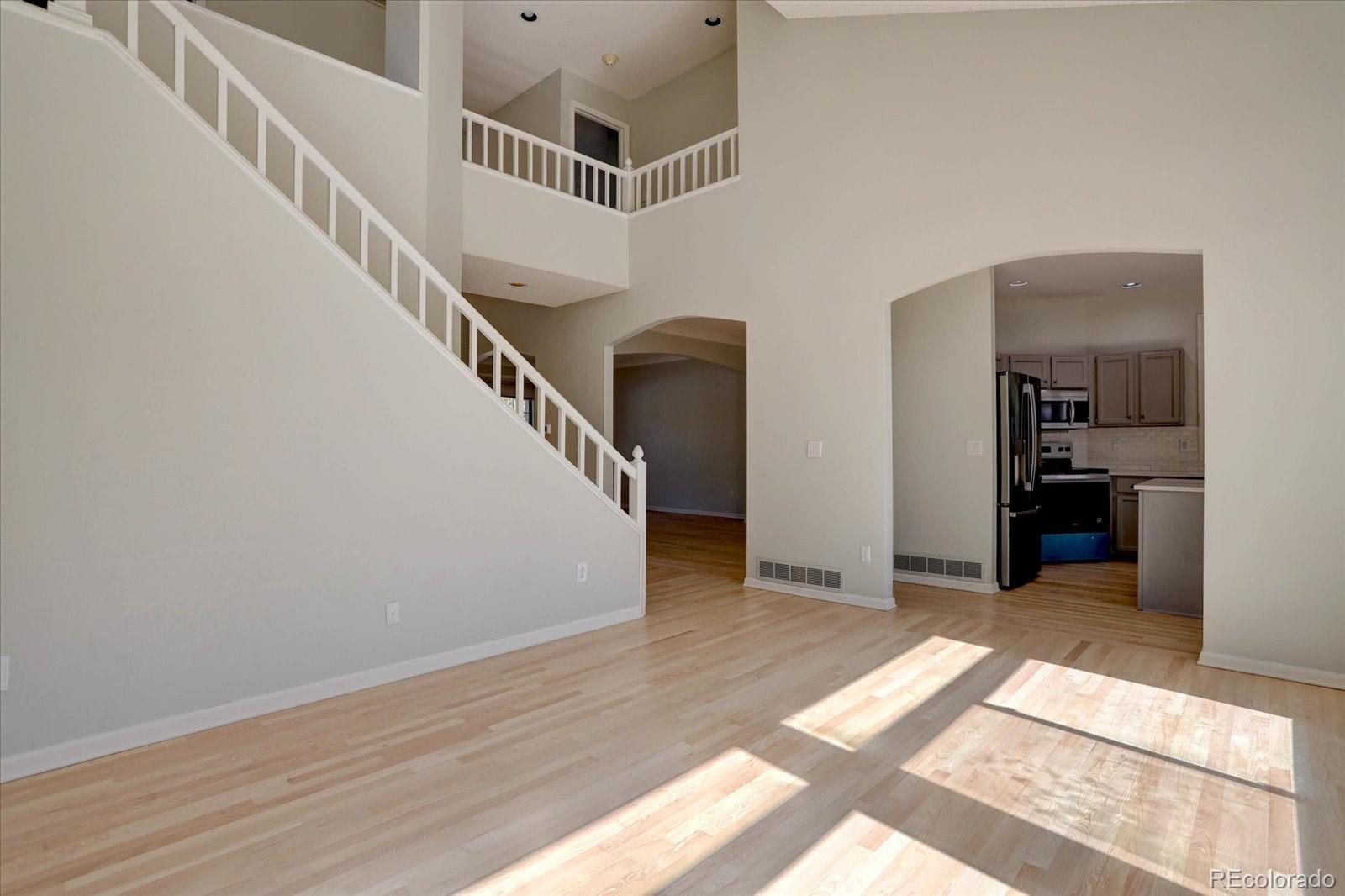 10312 Stoneflower Drive Parker, CO 80134 - Photo 13 of 43 a view of entryway and hall with wooden floor