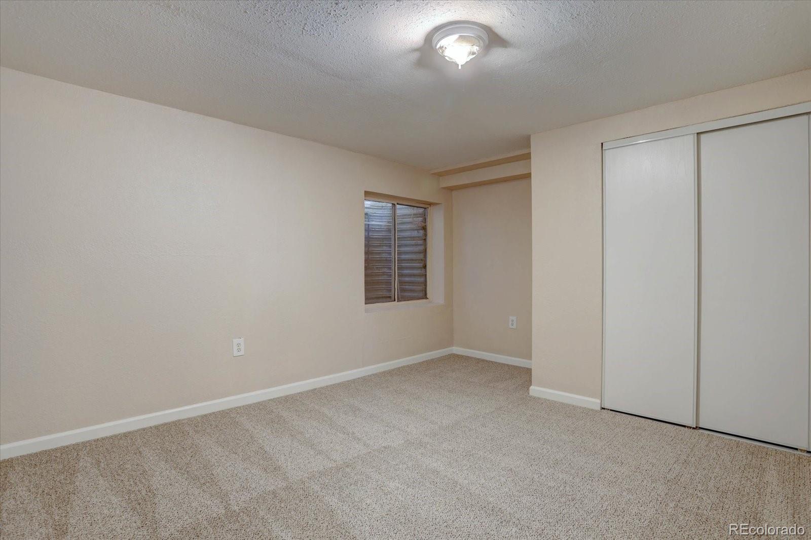 10312 Stoneflower Drive Parker, CO 80134 - Photo 29 of 43 an empty room with windows