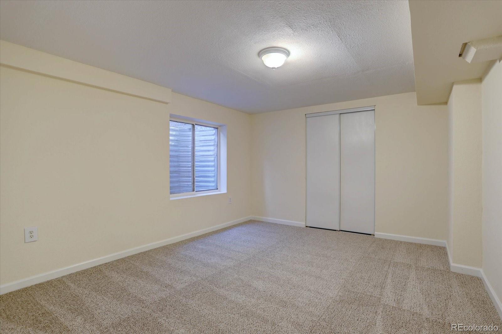 10312 Stoneflower Drive Parker, CO 80134 - Photo 31 of 43 an empty room with windows