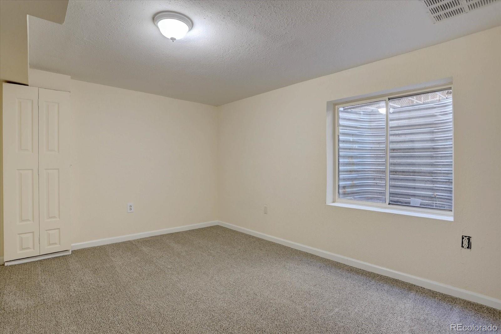 10312 Stoneflower Drive Parker, CO 80134 - Photo 34 of 43 an empty room with a window