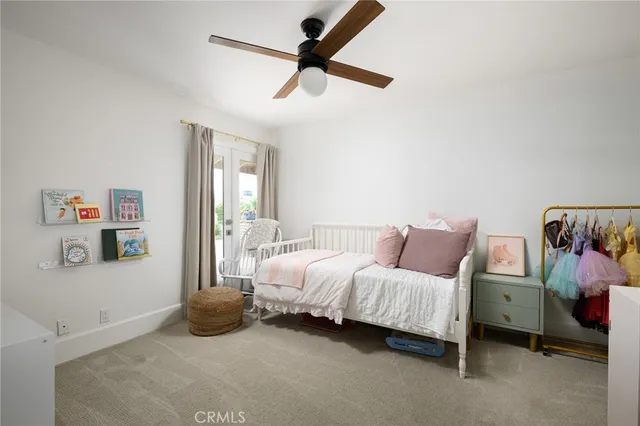 a room with a bed furniture and a window