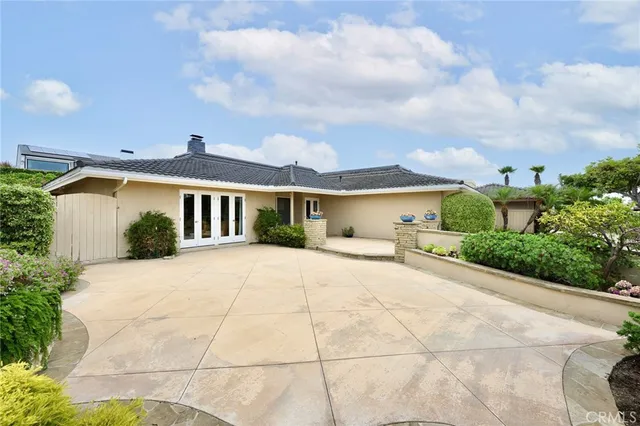 a view of house with yard and entertaining space