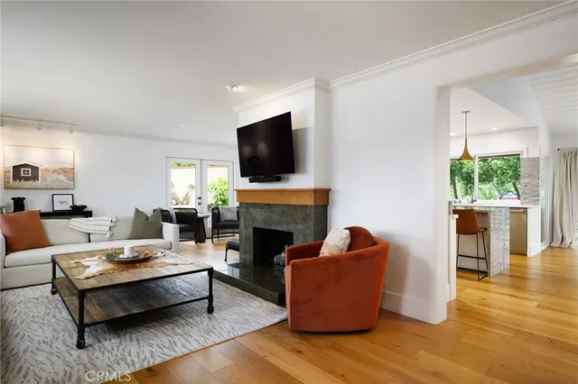 a living room with fireplace furniture and a flat screen tv