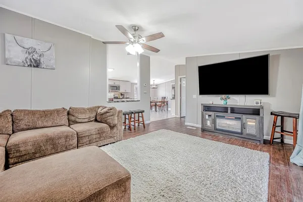 a living room with furniture and a flat screen tv