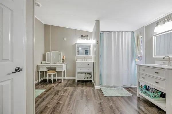 a room with furniture and a wooden floor