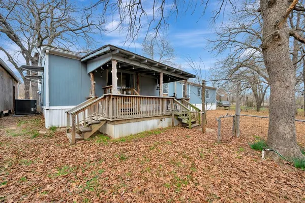 a house with trees in the background