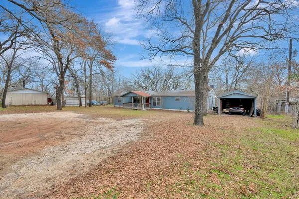a house with trees in front of it