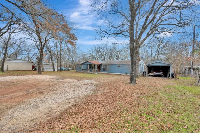 a house with trees in front of it