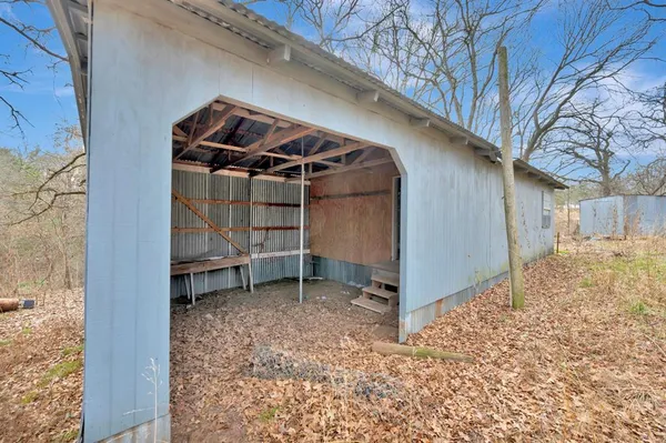 a view of wooden roof and tree
