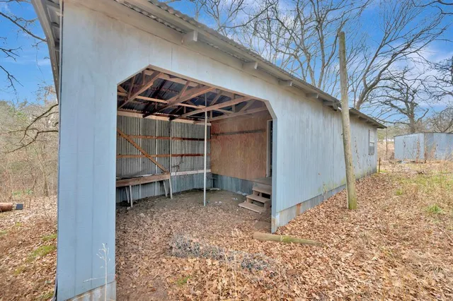 a view of wooden roof and tree