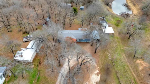 a backyard of apartments with large trees