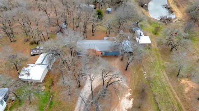 a backyard of apartments with large trees