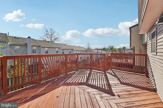 a balcony with a potted plant on both side