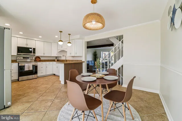 a large kitchen with granite countertop a stove oven and a sink