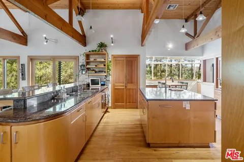 a kitchen with counter top space and stainless steel appliances