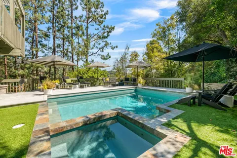 a view of a swimming pool with a patio