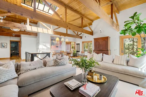 a living room with furniture and a table