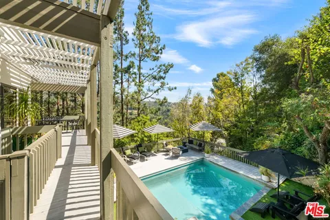 a view of a swimming pool with a patio