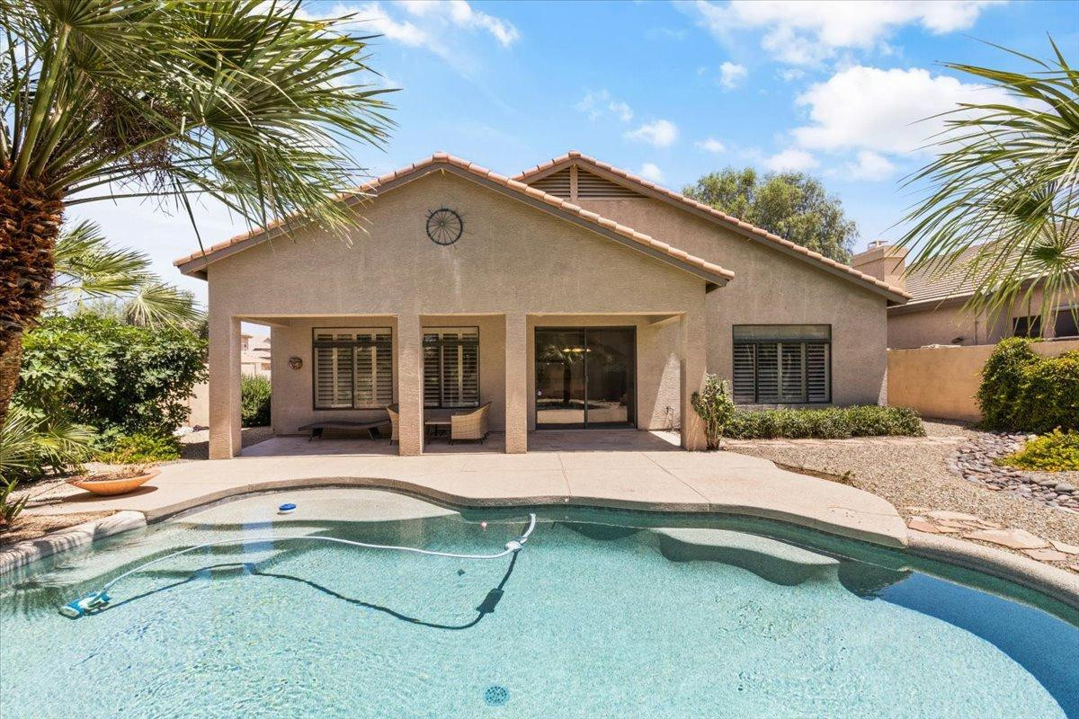 4211 East Kirkland Road Phoenix, AZ 85050 - Photo 19 of 23 a house that has a table and chairs in patio