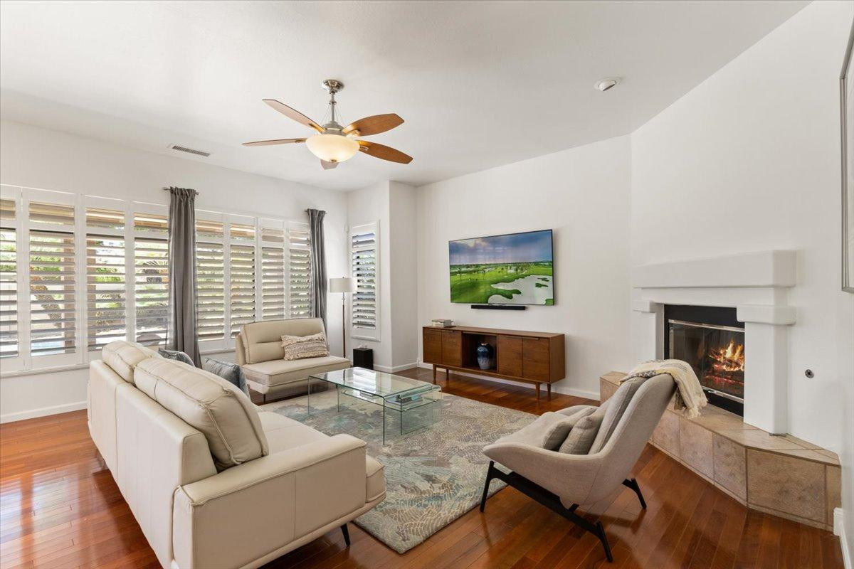 4211 East Kirkland Road Phoenix, AZ 85050 - Photo 3 of 23 a living room with furniture a fireplace and a large window