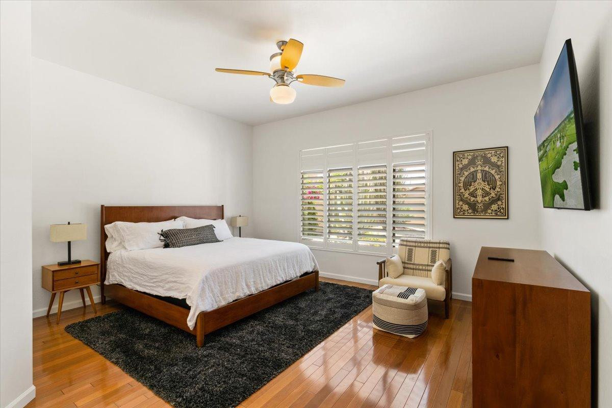 4211 East Kirkland Road Phoenix, AZ 85050 - Photo 10 of 23 a bedroom with a bed and a chandelier