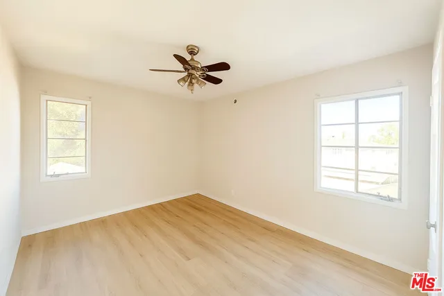 a view of a big room with windows