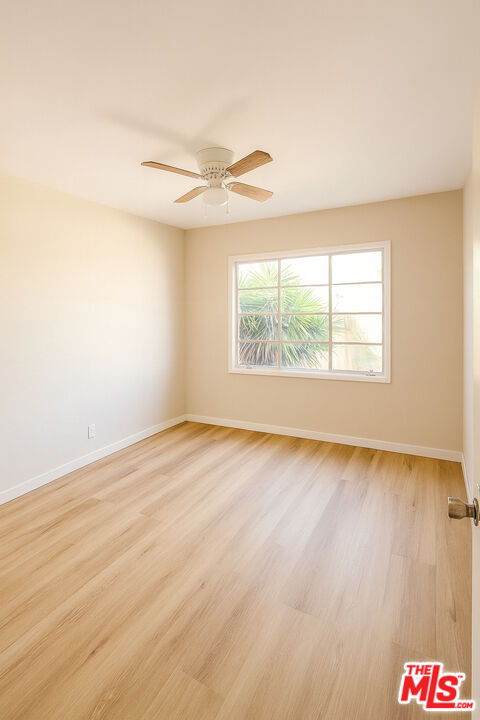4064 South Muirfield Road, Unit C Los Angeles, CA 90008 - Photo 6 of 19 an empty room with windows and fan