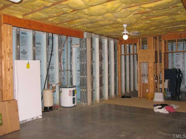 30 Piney Grove Road Bahama, NC 27503 - Photo 11 of 12 Unfinihsed basement with utility room and half-bath. Poured insulated concrete "Superior" walls. Oversized parking for 3 cars with extra length to accomodate boats or RV's. Outside concrete parking deck. Basement