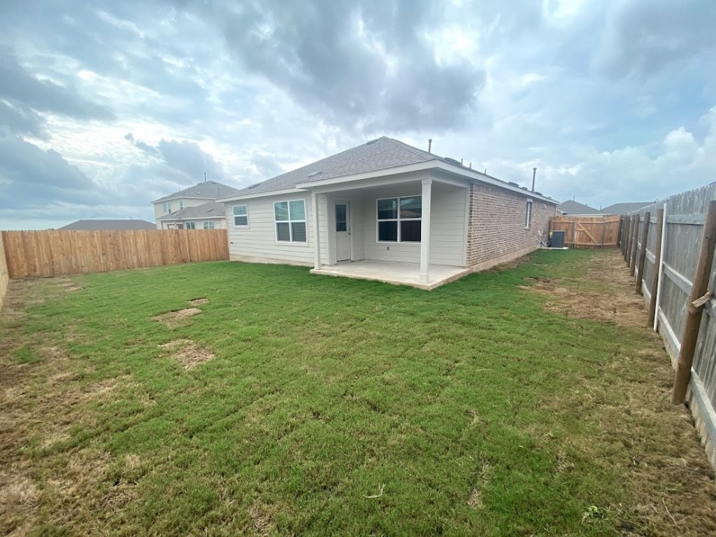 3106 Kenner Drive Pflugerville, TX 78660 - Photo 11 of 11 a big white house with a big yard and large trees