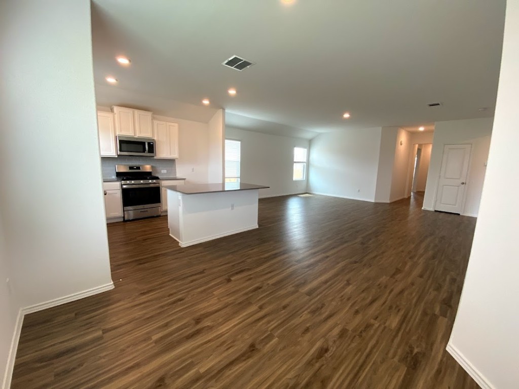 3106 Kenner Drive Pflugerville, TX 78660 - Photo 4 of 11 a view of kitchen with sink and wooden floor