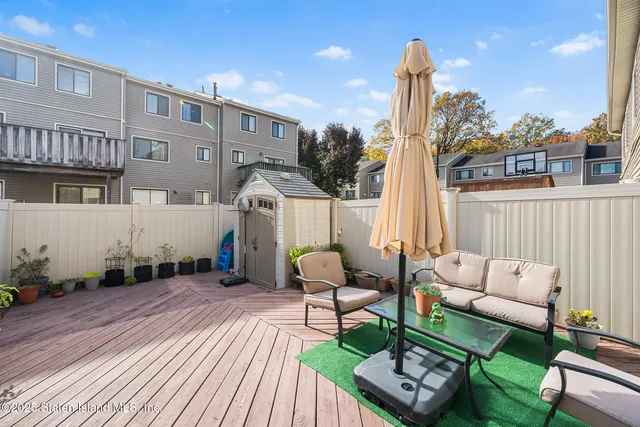 a house view with a sitting space and garden